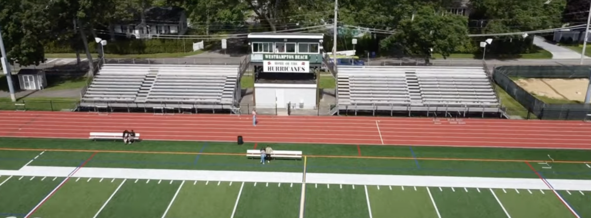 The current home bleachers with the press box and concession in the mdidle.
